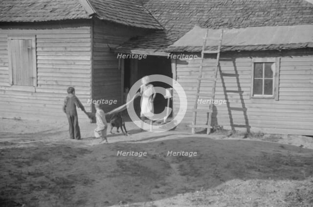 Burroughs children playing in the yard, Hale County, Alabama, 1936. Creator: Walker Evans.