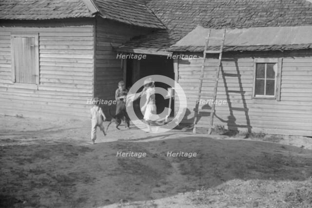 Burroughs children playing in the yard, Hale County, Alabama, 1936. Creator: Walker Evans.