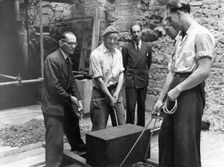 Burying a box containing copies of the "Jewish Chronicle", London, 1955. Creator: Unknown