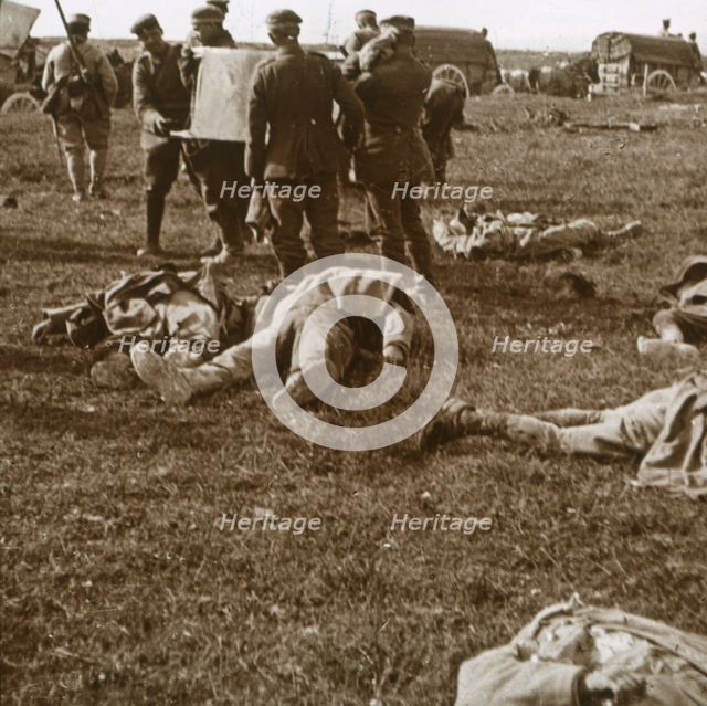 Burying bodies, Sainte-Marie-à-Py, northern France, c1914-c1918. Artist: Unknown.