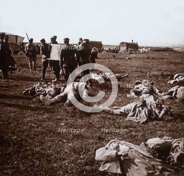 Burying bodies, Sainte-Marie-à-Py, northern France, c1914-c1918. Artist: Unknown.