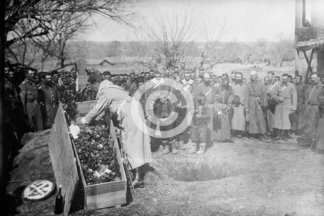 Burying soldier who cut barbed wire defence of Adrianople, 1913. Creator: Bain News Service.