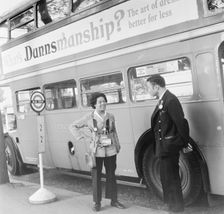 Bus conductress and driver at Crystal Palace, Sydenham, London, 1962. Creator: Henry Grant