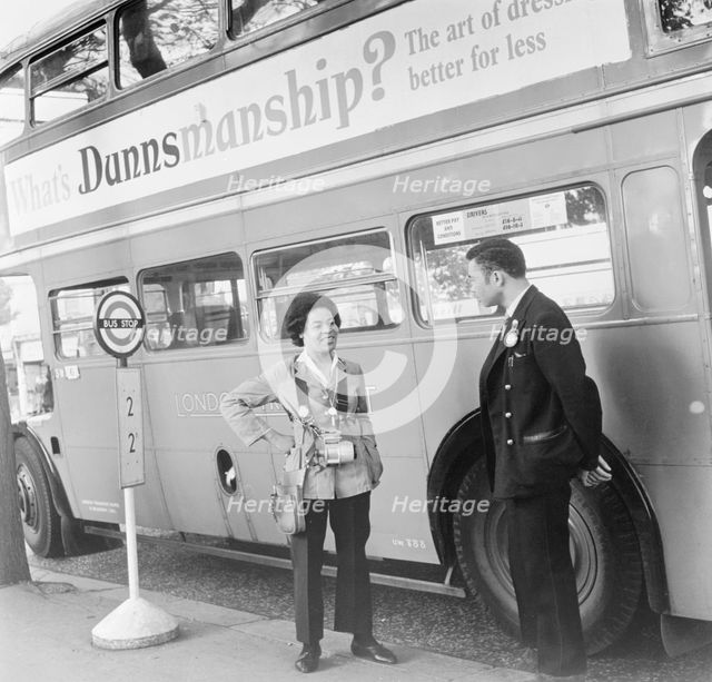 Bus conductress and driver at Crystal Palace, Sydenham, London, 1962. Creator: Henry Grant.