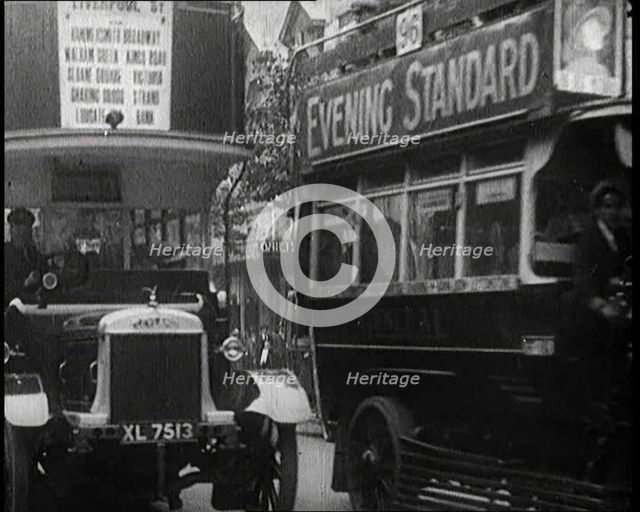Buses Driving by in London, 1922. Creator: British Pathe Ltd.