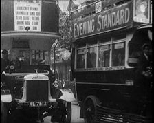 Buses Driving by in London, 1922. Creator: British Pathe Ltd