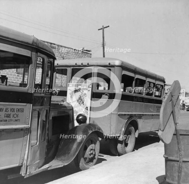 Buses operated by the city which are used only by Negroes, Daytona Beach, Florida, 1943. Creator: Gordon Parks.