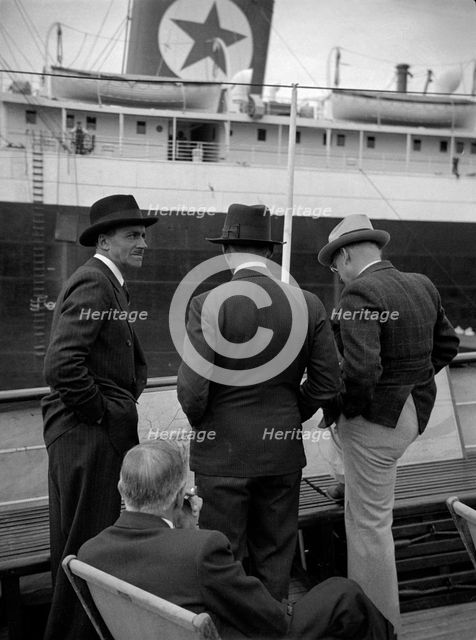 Businessmen on a ship in London docks, 1937. Artist: SW Rawlings