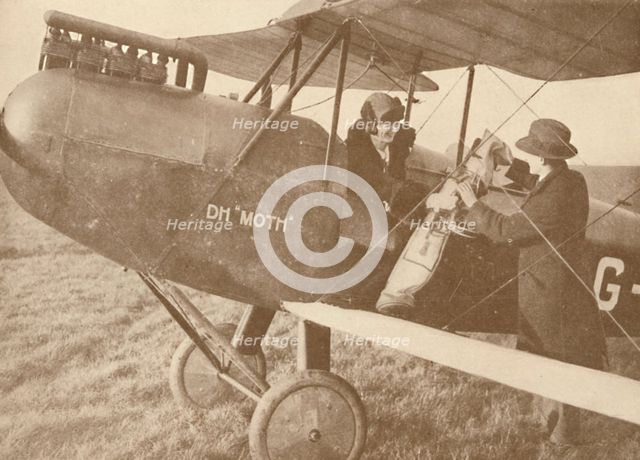 'By Air to the Golf Links in a Little 27-60 HP 'Moth' Light 'Plane', 1927. Artist: Unknown.