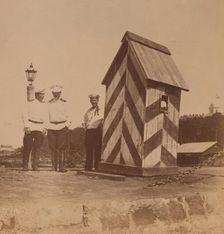 By the railway, three men in uniform standing near a guard booth, Vladivostok, Russia, 1899. Creator: Eleanor Lord Pray