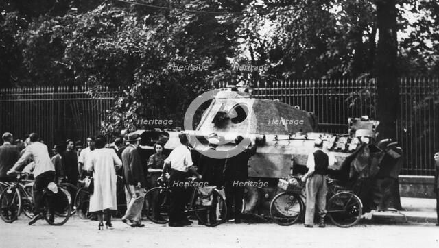 Bystanders examining an abandoned tank on the Rue de Medicis, liberation of Paris, August 1944. Artist: Unknown