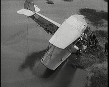 Bystanders Looking at the Wreckage of The American Legion After It Had Crashed, 1927. Creator: British Pathe Ltd