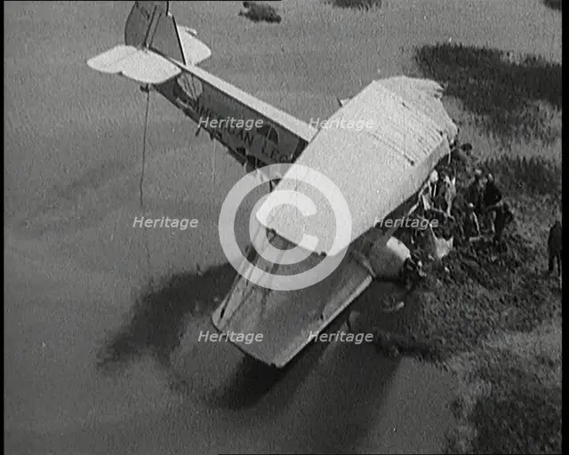 Bystanders Looking at the Wreckage of 'The American Legion' After It Had Crashed, 1927. Creator: British Pathe Ltd.