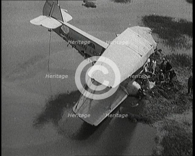 Bystanders Looking at the Wreckage of 'The American Legion' After It Had Crashed, 1927. Creator: British Pathe Ltd.