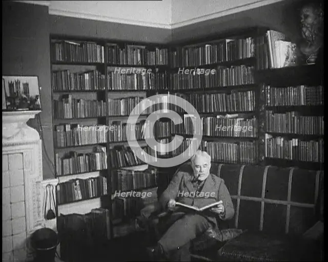 C.E.M Joad Reading a Book, 1930s. Creator: British Pathe Ltd.