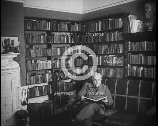 C.E.M Joad Reading a Book, 1930s. Creator: British Pathe Ltd.
