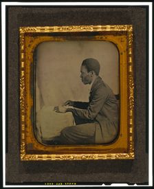 C.H. Hicks, in profile, seated at desk, between 1856 and 1858. Creator: Augustus Washington