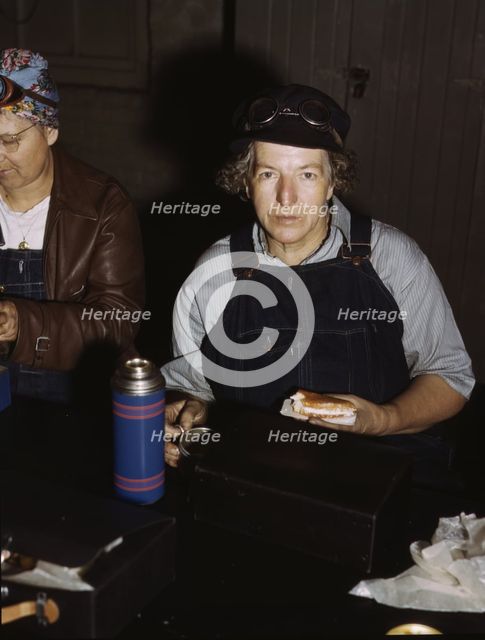 C. & N.W. R.R., Mrs. Elibia Siematter, employed as a sweeper at the roundhouse, Clinton, Iowa, 1943. Creator: Jack Delano.