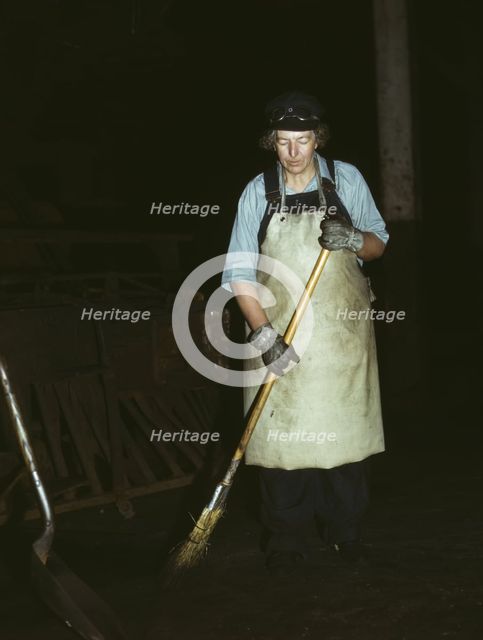 C. & N.W. R.R., Mrs. Elibia Siematter, working as a sweeper at the roundhouse, Clinton, Iowa, 1943. Creator: Jack Delano.