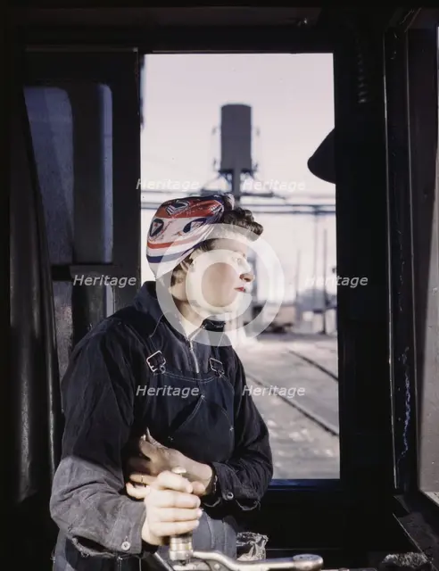 C. & N.W. R.R. Cloe Weaver, mother of four children, employed...the roundhouse, Clinton, Iowa, 1943. Creator: Jack Delano.