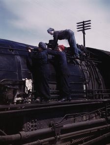 C. & N.W. R.R., women wipers at the roundhouse cleaning one of the giant..., Clinton, Iowa, 1943. Creator: Jack Delano