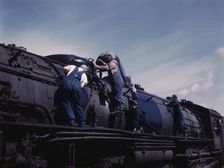 C. & N.W. R.R., women wipers employed at the roundhouse cleaning one of the..., Clinton, Iowa, 1943. Creator: Jack Delano