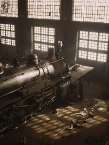C & NW RR working on a locomotive at the 40th Street railroad shops, Chicago, Ill., 1942. Creator: Jack Delano