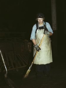C. & N.W. R.R., Mrs. Elibia Siematter, working as a sweeper at the roundhouse, Clinton, Iowa, 1943. Creator: Jack Delano