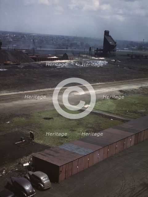C & NW RR railroad workers cultivating a little Victory garden at Proviso yard, Chicago, Ill., 1943. Creator: Jack Delano.