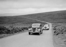 GM Denton's Ford V8 leading the Delahaye of DA Loader at the MCC Torquay Rally, July 1937. Artist: Bill Brunell