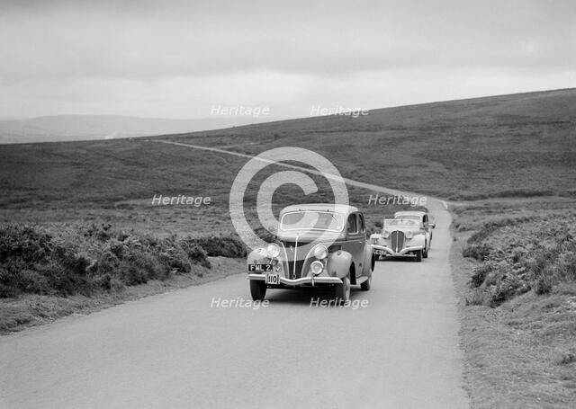 GM Denton's Ford V8 leading the Delahaye of DA Loader at the MCC Torquay Rally, July 1937. Artist: Bill Brunell.