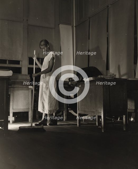 Government charwoman cleaning after regular working hours, Washington, D.C., 1942. Creator: Gordon Parks.