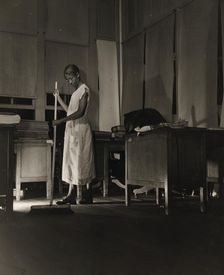 Government charwoman cleaning after regular working hours, Washington, D.C., 1942. Creator: Gordon Parks