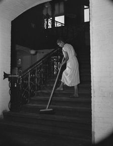Government charwoman cleaning after regular working hours, Washington, D.C., 1942. Creator: Gordon Parks