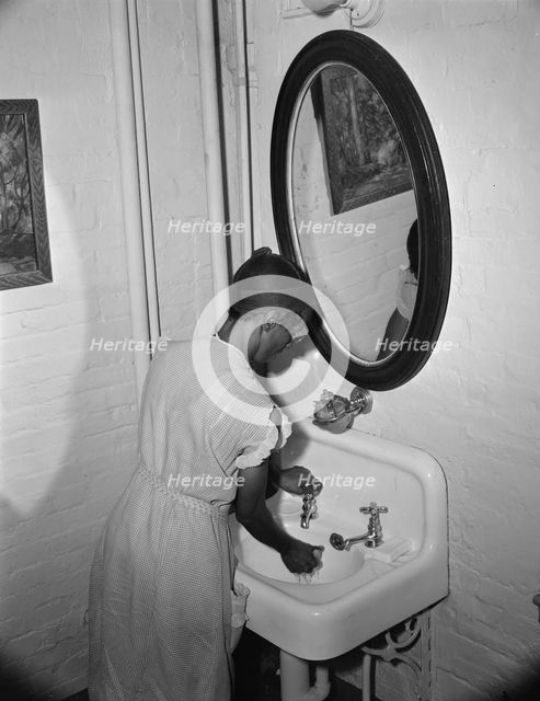 Government charwoman cleaning offices, Washington, D.C., 1942. Creator: Gordon Parks.