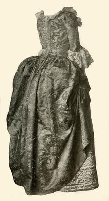 Gown of yellow damask brocade worn over a blue quilted satin petticoat, c1710-1730, (1937). Creator: Unknown