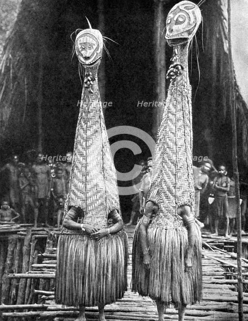 Goblin masks and visors worn as beauty aids, Papua, New Guinea, 1936.Artist: Fox Photos