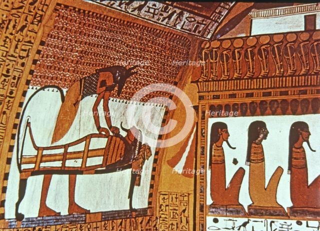 God Anubis mummifying a deceased, fresco in the tomb of Sennutem.