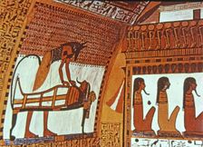 God Anubis mummifying a deceased, fresco in the tomb of Sennutem