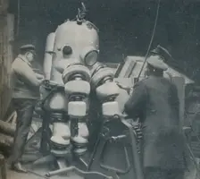 Going Down at Short Notice: A British Diver Preparing To Seek a Submarine at Sea Bottom c1935. Artist: Pacific and Atlantic