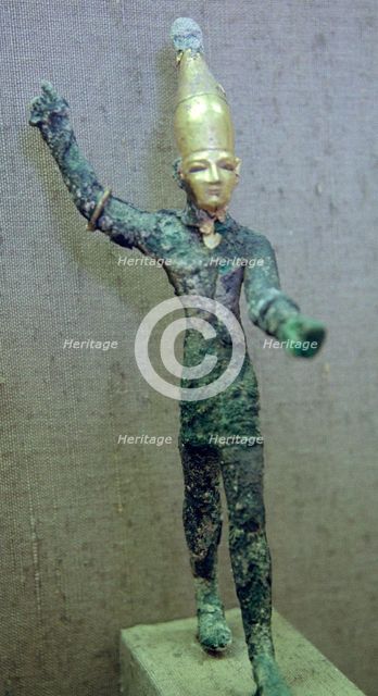 Gold and bronze statuette of Baal hurling a thunderbolt. Artist: Unknown