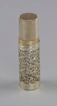 Gold and glass perfume bottle from Mae's Millinery Shop, 1941-1994. Creator: Anne Paree