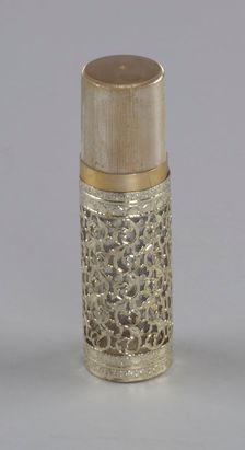 Gold and glass perfume bottle from Mae's Millinery Shop, 1941-1994. Creator: Anne Paree