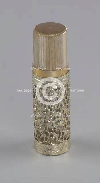 Gold and glass perfume bottle from Mae's Millinery Shop, 1941-1994. Creator: Anne Paree.