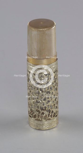 Gold and glass perfume bottle from Mae's Millinery Shop, 1941-1994. Creator: Anne Paree.