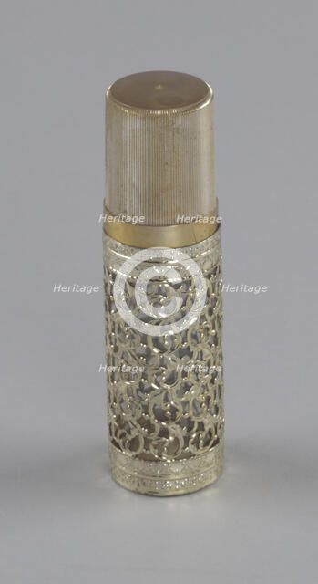 Gold and glass perfume bottle from Mae's Millinery Shop, 1941-1994. Creator: Anne Paree.