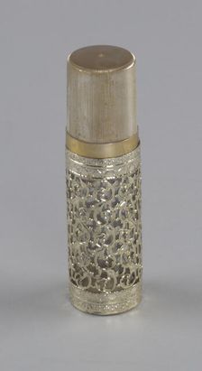 Gold and glass perfume bottle from Mae's Millinery Shop, 1941-1994. Creator: Anne Paree