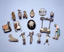 Gold and silver jewellery with a golfing theme, 1910-1938. Creator: Unknown