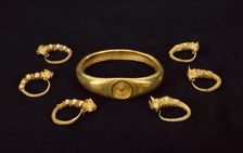 Gold earrings and gold armlet, fom a temple treasure, 4th-3rd century BC