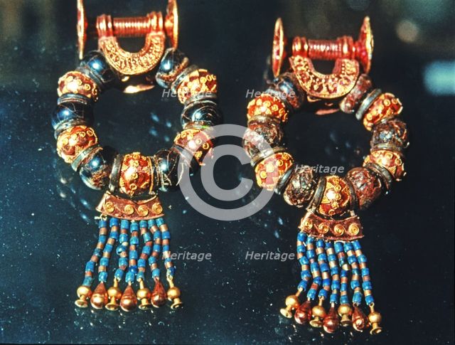 Gold earrings and jewels from the grave goods in Tutankhamun's tomb treasury.